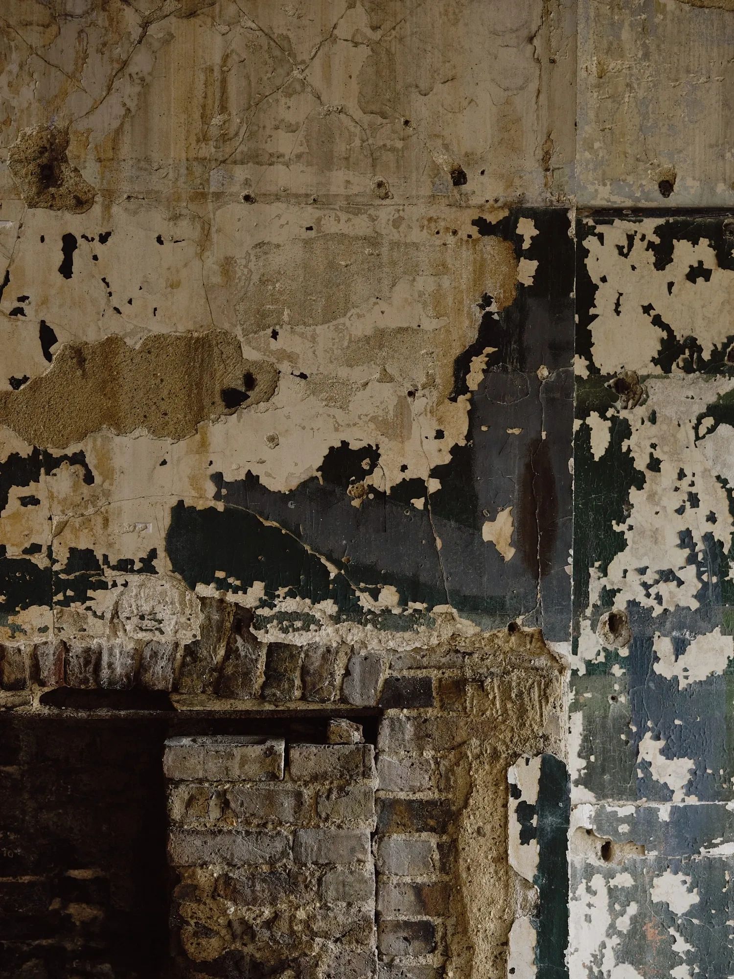 Layers of historic plaster, paint and exposed masonry