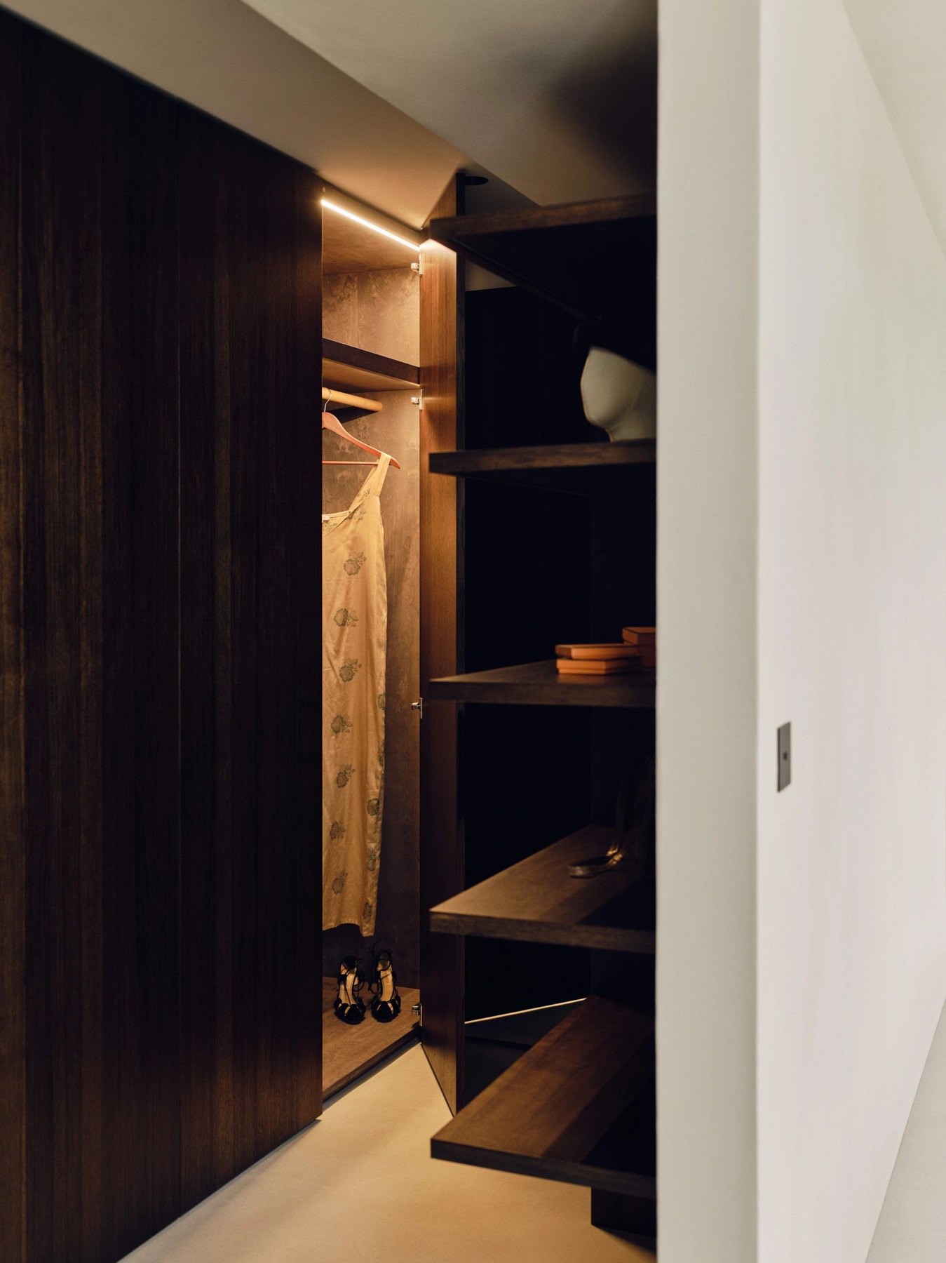 Bespoke timber wardrobes with warm integrated lighting